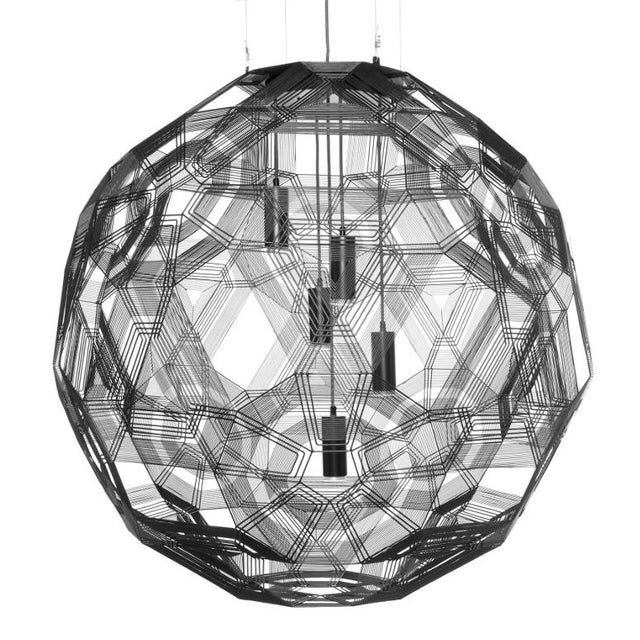Handmade from malleable galvanized iron wire, the Zattelite 10 pendant by Schema for Oggetti presents a dramatic, large-...