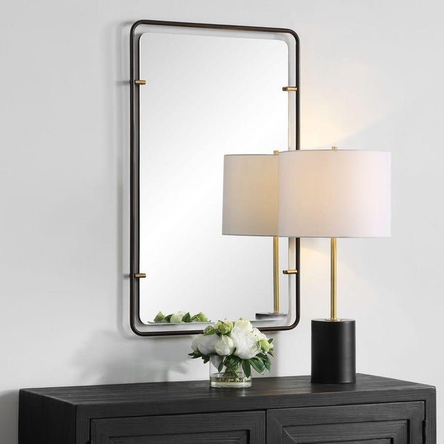 Striking yet versatile, this mirror is best described as transitional with industrial influences. This slim, rounded metal...