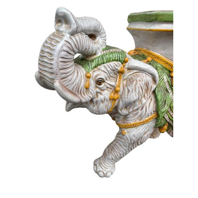 Vintage Italian terracotta elephant plant stand or statue made in Italy. The elephant statue is painted in white, green...