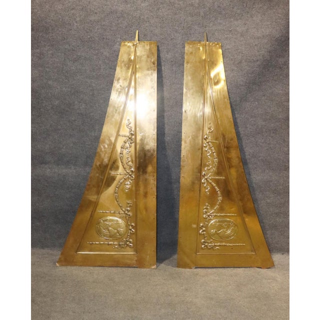 This striking pair of monumental brass architectural valances is an exceptional example of late nineteenth to early...