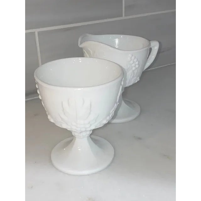 Pure white and gorgeous, this classic milk glass sugar and creamer was made by the Indiana Glass Company between the...