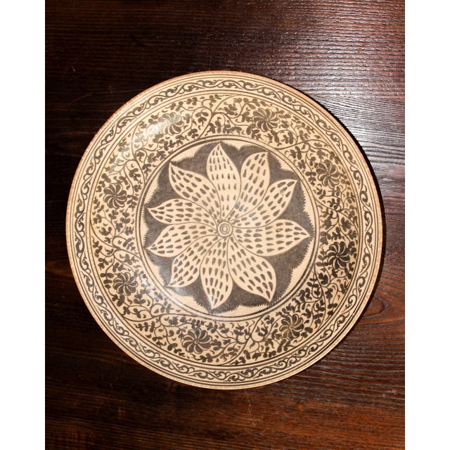 This elaborately decorated large 15th-century stoneware plate was produced in Wang Kalong kiln in Northern Thailand. The...