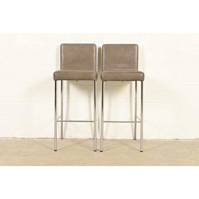 A gorgeous pair of contemporary or Modern "Switch" bar stools By Coalesse for Steelcase USA, 2010 Leather upholstered...