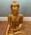 A striking antique Burmese gilt Buddha sculpture from Myanmar, depicted seated in the classic lotus position with a serene...
