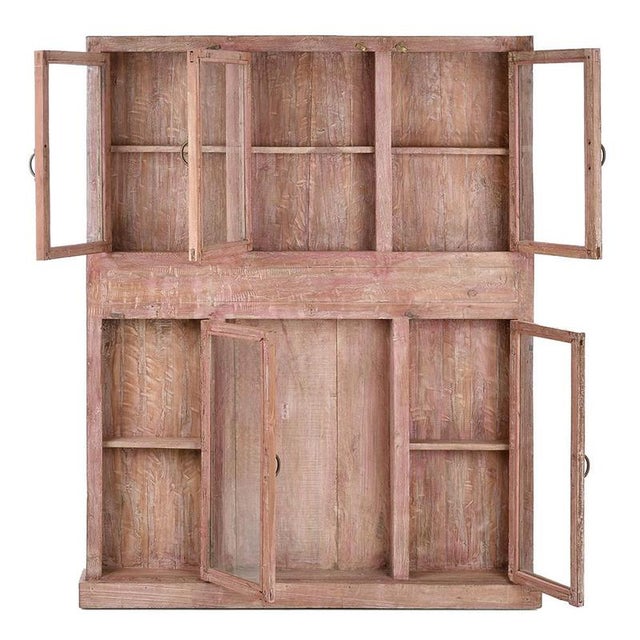 This weathered wooden wall display case is a piece of character, ideal for adding a touch of rustic charm to your...