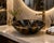 Bring timeless elegance to your bathroom with this handcrafted Black & Gold Marble Vessel Sink, carved from a single piece...
