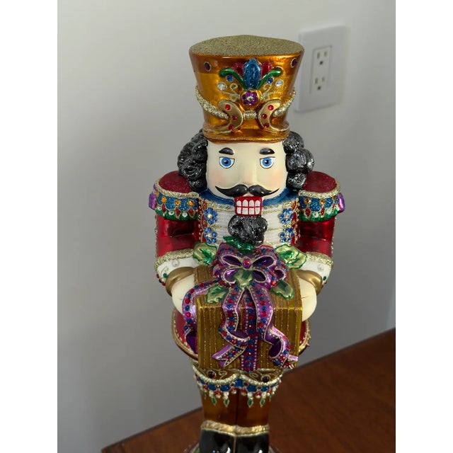 This is a large rare exceptional vintage collectible jewel nutcracker Christmas tree topper with a stand that was made in...