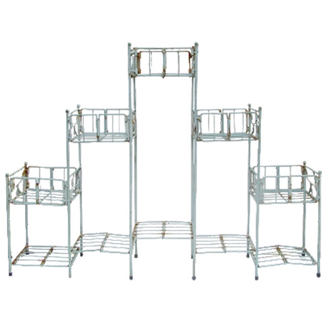What fabulous patina and style co-exist in this vintage metal plant stand! The stand consists of 5 square towers of...