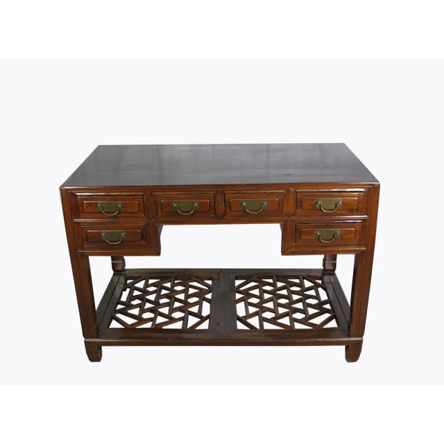 This walnut brown vintage Chinese desk has 5 drawers and a beautiful cracked ice foot rest. This vintage writing desk adds...