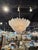 The Murano Granola Glass 2-tier Leaf Form Flush Mount Chandelier is a unique and elegant lighting fixture that adds a...