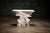 Sirmos 'Rock Quarry' Console Table in white plaster with a sculptural design inspired by natural rock formations. This...