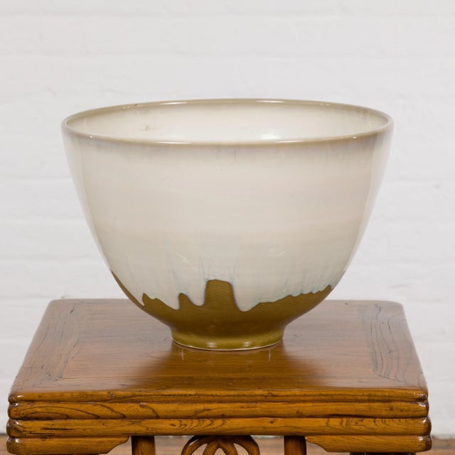 A Prem Collection Contemporary White & Brown Glazed Ceramic Bowl from the 21st century. Exuding elegance and modern...