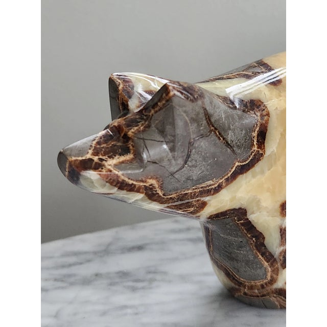 A vintage onyx bear figurine carved smooth into a modern shape. Makes a great paperweight or bookend. In excellent vintage...