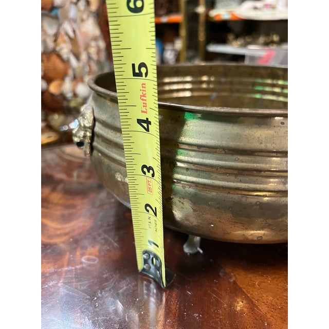 Up for consideration is a beautiful vintage MCM brass round decorative bowl with lion head accents. This would look lovely...