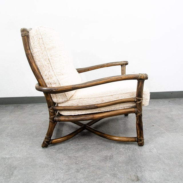 Offered is a beautifully preserved vintage McGuire bamboo armchair, iconic example of McGuire's timeless craftsmanship-...