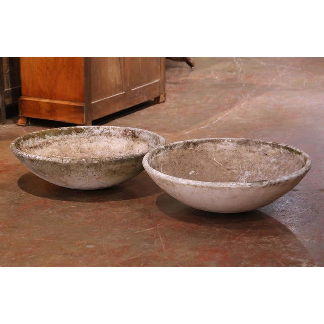 This sculptural pair of vintage planters was designed by Willy Guhl for Eternit in Switzerland, circa 1950. Executed in...