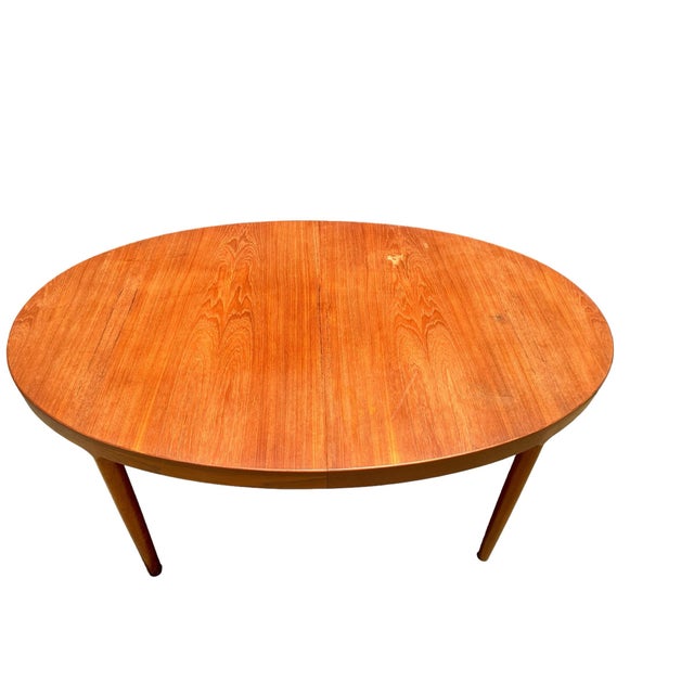 Randers Mobelfabrik Two leaf oval teak table. Made in Denmark with makers mark.