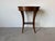 Elegant vintage Italian side table or nightstand featuring a refined oval top, a single drawer with original brass pull,...