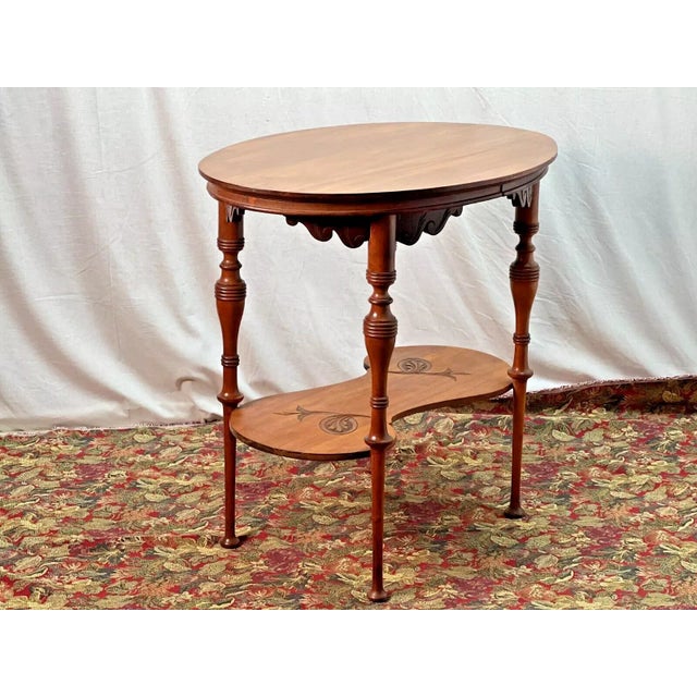 Enhance your space with this stunning Cherry Oval Center Table from the 19th century. This Art Novel piece has been fully...