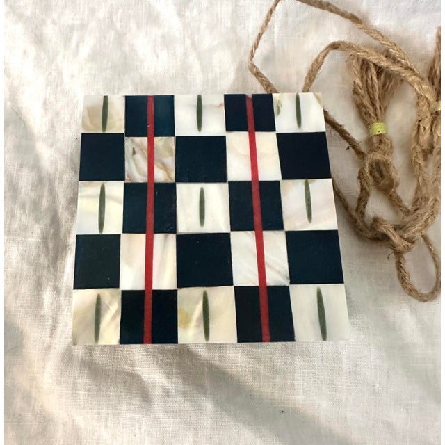 Anthropologie set of 4 iridescent mother of pearl inlay checker board print. Has a cork backing. 4in x 4in Make sure to...