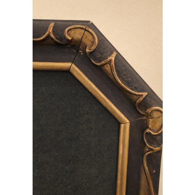 Offered as a matching pair, these early 20th-century decorative prints are presented in their original period giltwood...