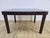 A very elegant art deco dining table from the 1950s. Made entirely of wood, veneered with high-gloss rosewood. Preserved...