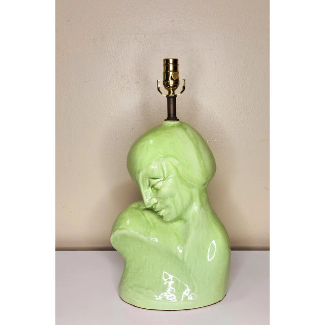 The glaze on this lamp speaks enough for its self. With the delicate curves of the bust, and the spring green glaze this...