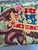 A striking vintage handcrafted wall textile depicting a regal Mughal elephant procession. This impressive textile (52” x...