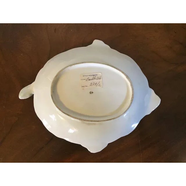 A large and beautiful 18th c. Chelsea cabbage leaf dish with basket weave border measuring 10 3/4" long x 8 3/4" wide....