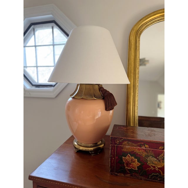About Elevate your space with this distinctive ginger jar table lamp, featuring a warm shade of peach that brings...
