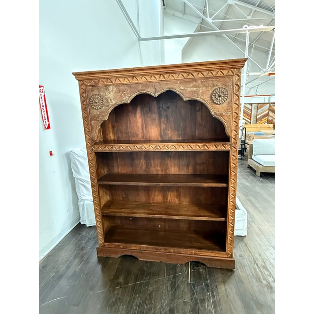 Design Plus Gallery presents a Vintage Carved Wood Open Bookcase. The tall rectangular frame is detailed with geometric...