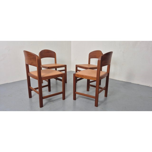Set of 4 dining room chairs by Mikael Laursen in solid teak with leather-covered seats. I have official proof of...
