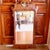 A handsome English scroll crested walnut frame profile contains a raised walnut inner moulding terminating with a pointed...