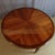 Large marquetry dining table with gilt bronze mounts. This table has two extension leaves with matching marquetry bands....
