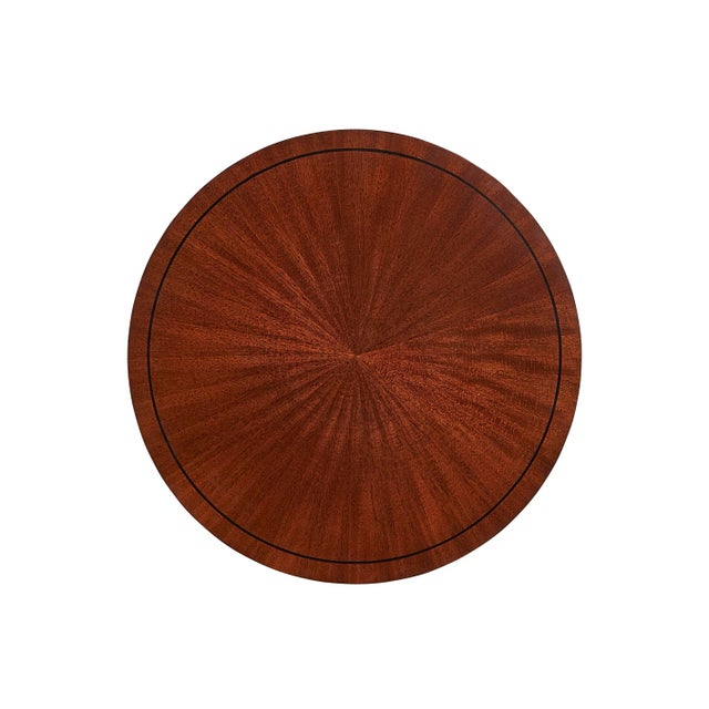 Mahogany side table with marquetry inlay and hand painted gold details. The cast brass base depicts a plant and duck...