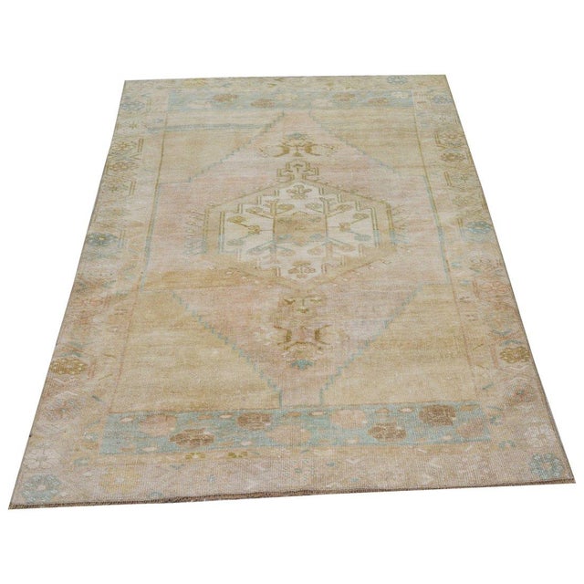 Hand-knotted with care using traditional rug-making techniques, this wool rug blends timeless craftsmanship with a modern...