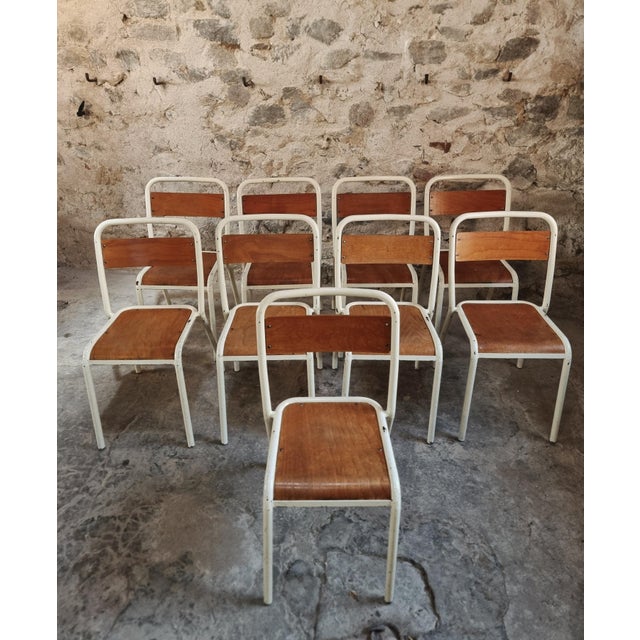 Set of 9 vintage French school chairs from the 1960s/70s. These classic stackable chairs were widely used in schools and...