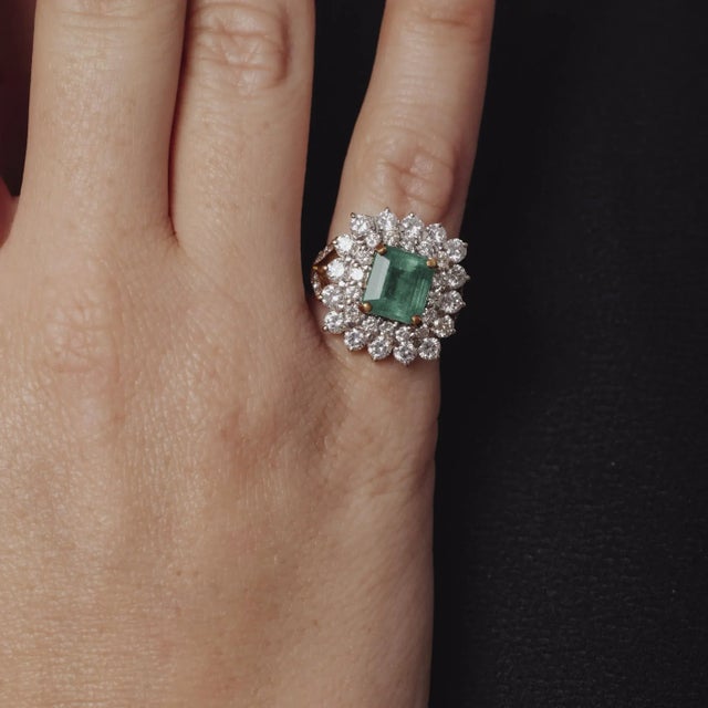 This vintage 1980’s ring showcases a striking 2.15 carat emerald, framed by 1.35 carats of brilliant diamonds. Crafted in...