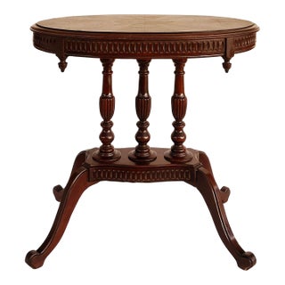 Early 20th Century Mahogany Oval Parlor Table With Matched Veneer Top Supported by Turned Columns For Sale
