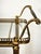Vintage brass and glass bar cart, made between the 1950s and 1970s in the Hollywood Regency style. Solid brass frame with...