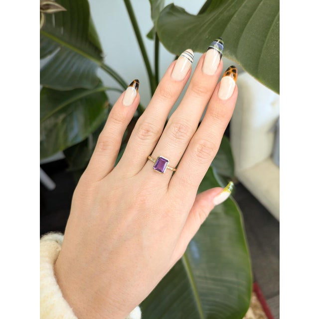 2.1 ct rich Zambian amethyst set in solid 14k gold, accented with sparkling natural diamonds for refined brilliance....