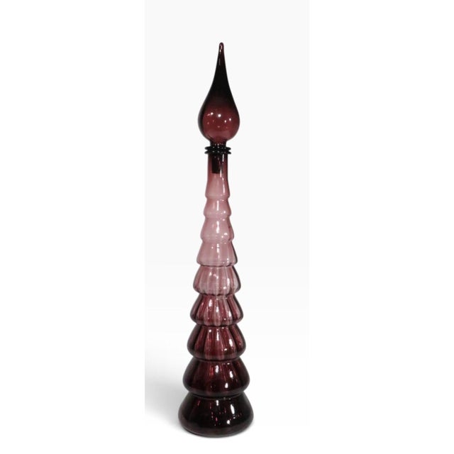 Iconic Italian Art Glass Genie form stoppered bottle by Empoli Rossini, circa 1960's. Executed in amethyst, purple glass,...
