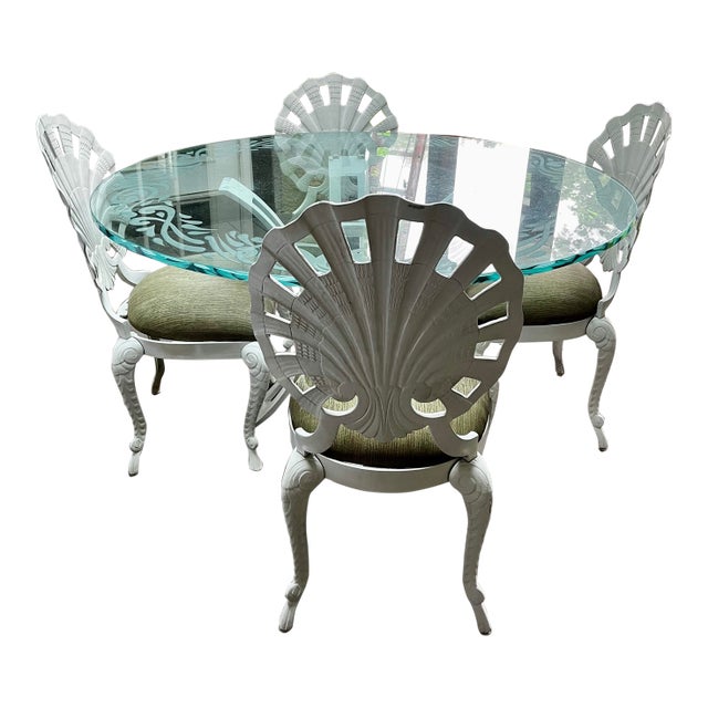 Four classic outdoor dining chairs from Brown Jordan, in their Grotto collection. Features the signature coastal elegance...