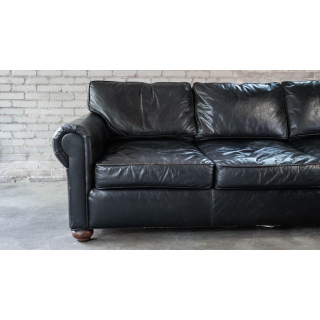 Restoration Hardware Lancaster ebony leather sofa, three-seat model. Premium down-feather filled cushions and soft, supple...