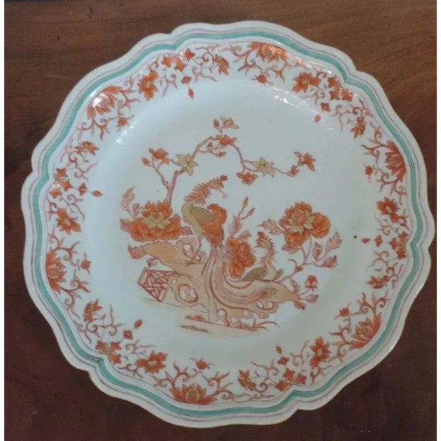 Large antique 18th c. Chinese porcelain round charger showing a peacock in a garden with a Chippendale gate. Decorated in...