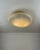 Flush-mount light with a clear Murano glass diffuser made in the ‘Vetro Maculato’ technique (white spot) and hung on a...