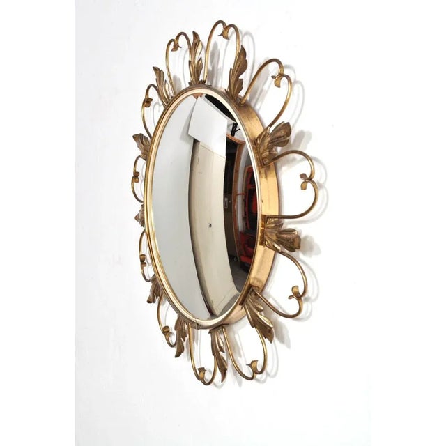 Beautiful brass chrome mirror from the 1960s. The mirror has convex mirror glass. Dimensions: diameter 45 cm (diameter...