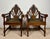Striking pair of early 20th century Spanish armchairs crafted in solid oak with richly carved details and strong...