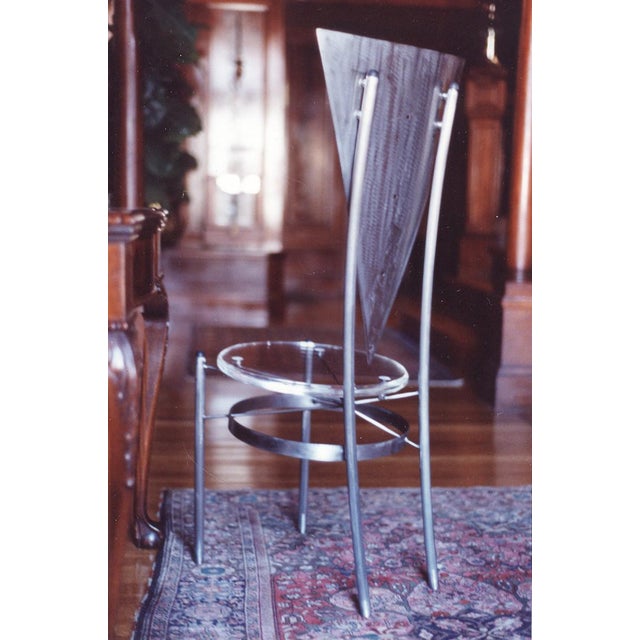 With its crossed braces and circular stretcher, the Stēl side chair has a unique structure, so I've given it a ¾"-thick...