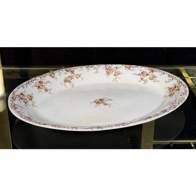 This large oval ironstone platter by Bourne & Leigh of Burslem, England carries the Aberdeen pattern in brown...